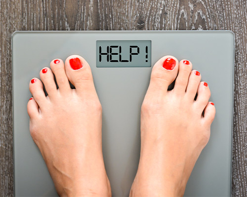 WEIGHT GAIN Feet on scale with text that says help